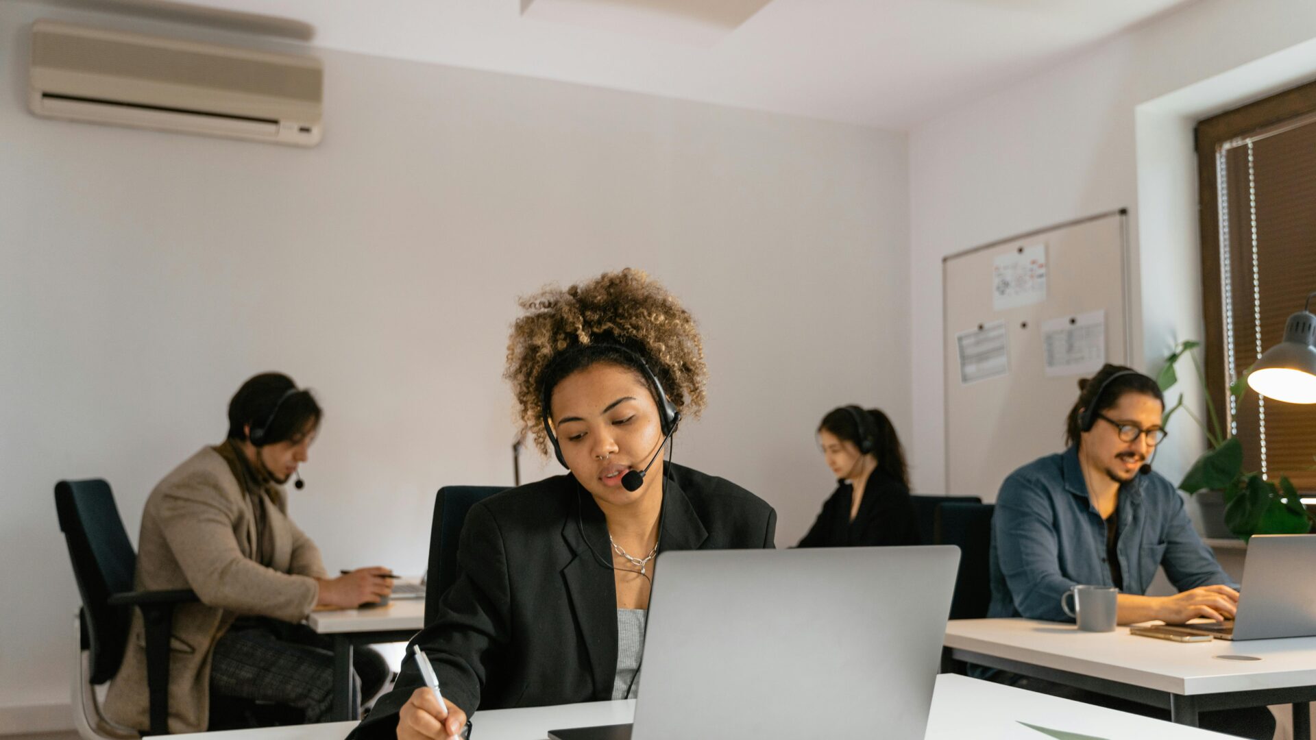 AI receptionist cost UK 2026 customer support team handling business enquiries